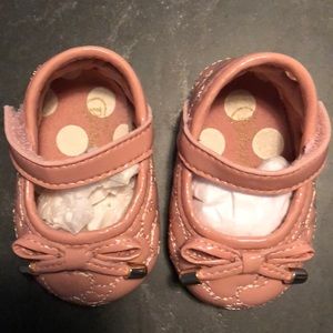 Pink patent leather crib shoes